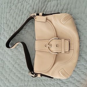 Small cream colored leather coach bag